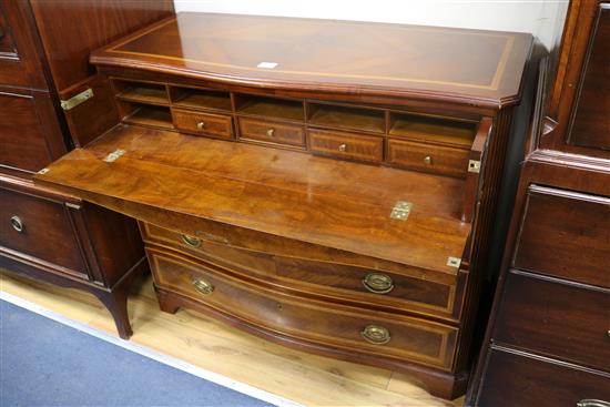 A mahogany serpentine inlaid chest of drawers W.110cm